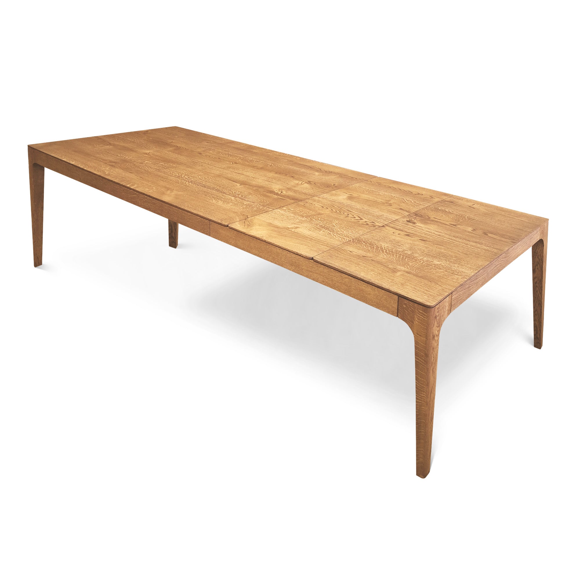 Table à manger extensible en chêne – La table de salle à manger en chêne affiche un design élégant et contemporain, caractérisé par ses lignes fluides et son épaisseur fuselée