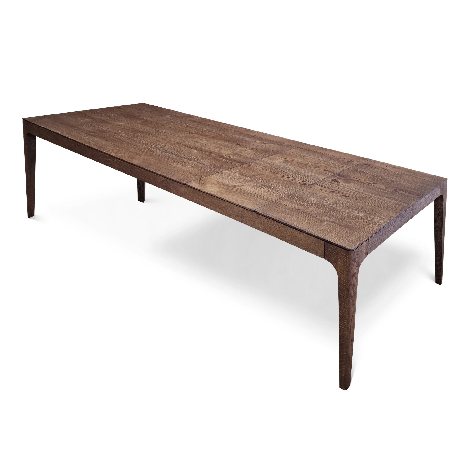 Table à Manger Extensible en Chêne Chocolat - La table à manger extensible en chêne chocolat se distingue par son design épuré et contemporain, caractérisé par son plateau lisse