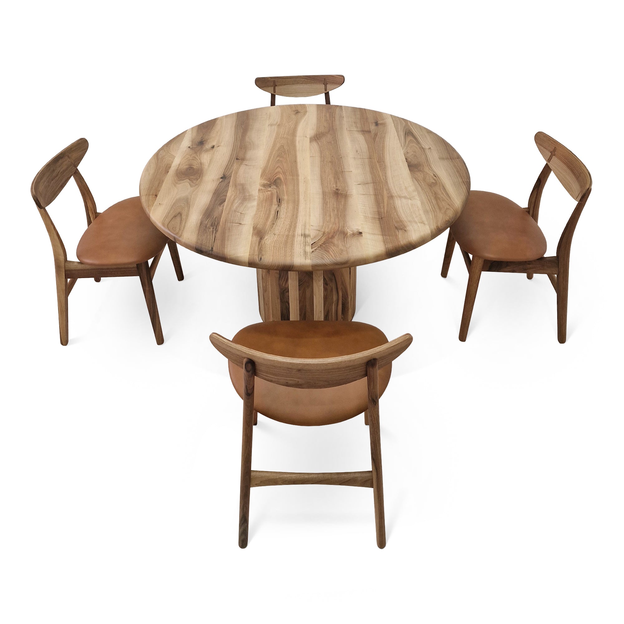 Table à Manger Ronde Extensible en Noyer - Cette luxueuse table à manger ronde – fabriquée à la main avec expertise à partir de noyer massif européen de première qualité – incarne