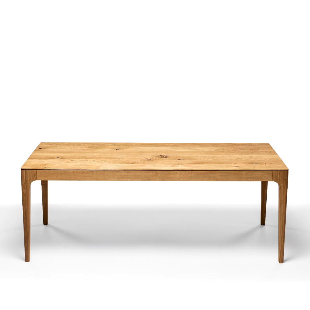 Table à manger extensible en chêne – La table de salle à manger en chêne affiche un design élégant et contemporain, caractérisé par ses lignes fluides et son épaisseur fuselée