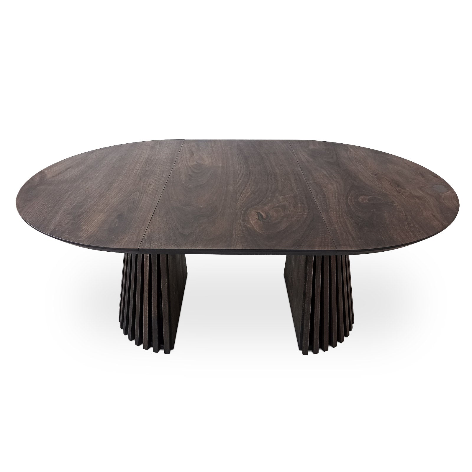 La table de salle à manger ronde extensible en noyer anthracite – avec son pied tubulaire distinctif à facettes – est un chef-d'œuvre unique et sur mesure qui fusionne